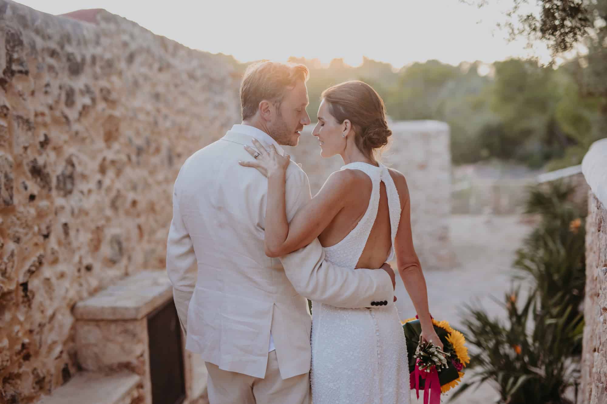 tim and sophies dream wedding at can frare ibiza feature image couple standing close together after getting married